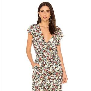 Like new Free People Ruffle Your Feathers floral jumpsuit size SM.